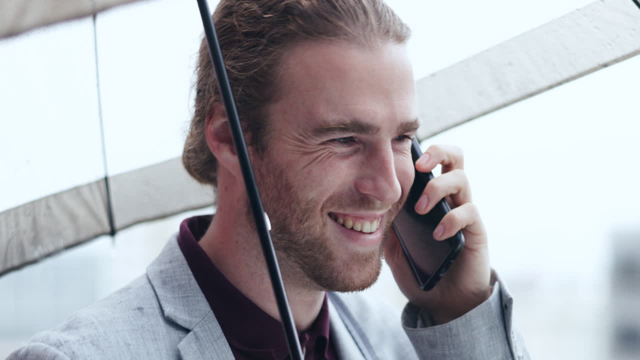 Phone call, happy and businessman with an umbrella