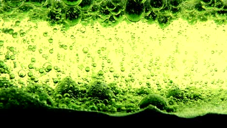 water oil bubbles  behind glass background