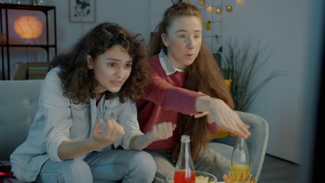 two women watching tv