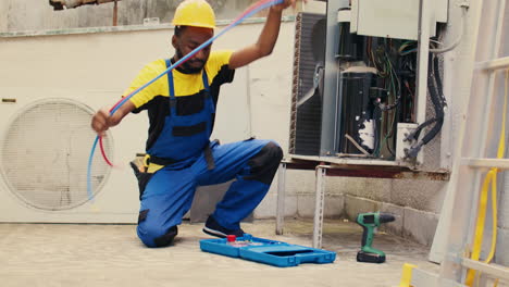 worker doing condenser maintenance