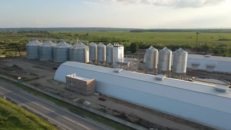 aerial view of industrial ventilated silos for long term storage of grain and oilseed. metal elevator for wheat drying in agricultural zone