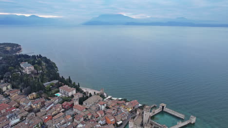 aerial view of small town by water in italy