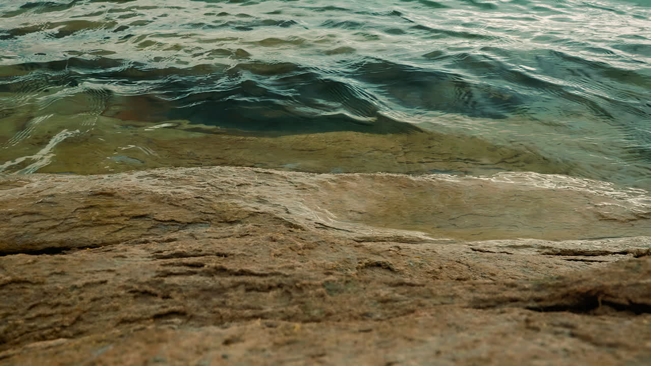 Rocky Coast And Wavy Water Of Lake