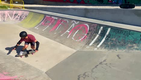 Camera-follow-fitness-and-surfer-man-in-concrete-bowl