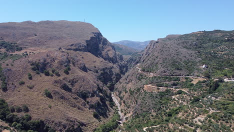 drone view of narrow topoliana gorge in arid mountains of crete, greece