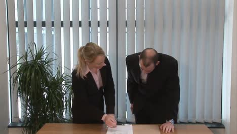 business people signing a contract