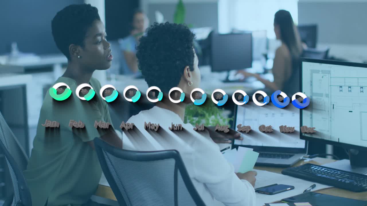 Animation of financial data and graphs over diverse female coworkers working in office