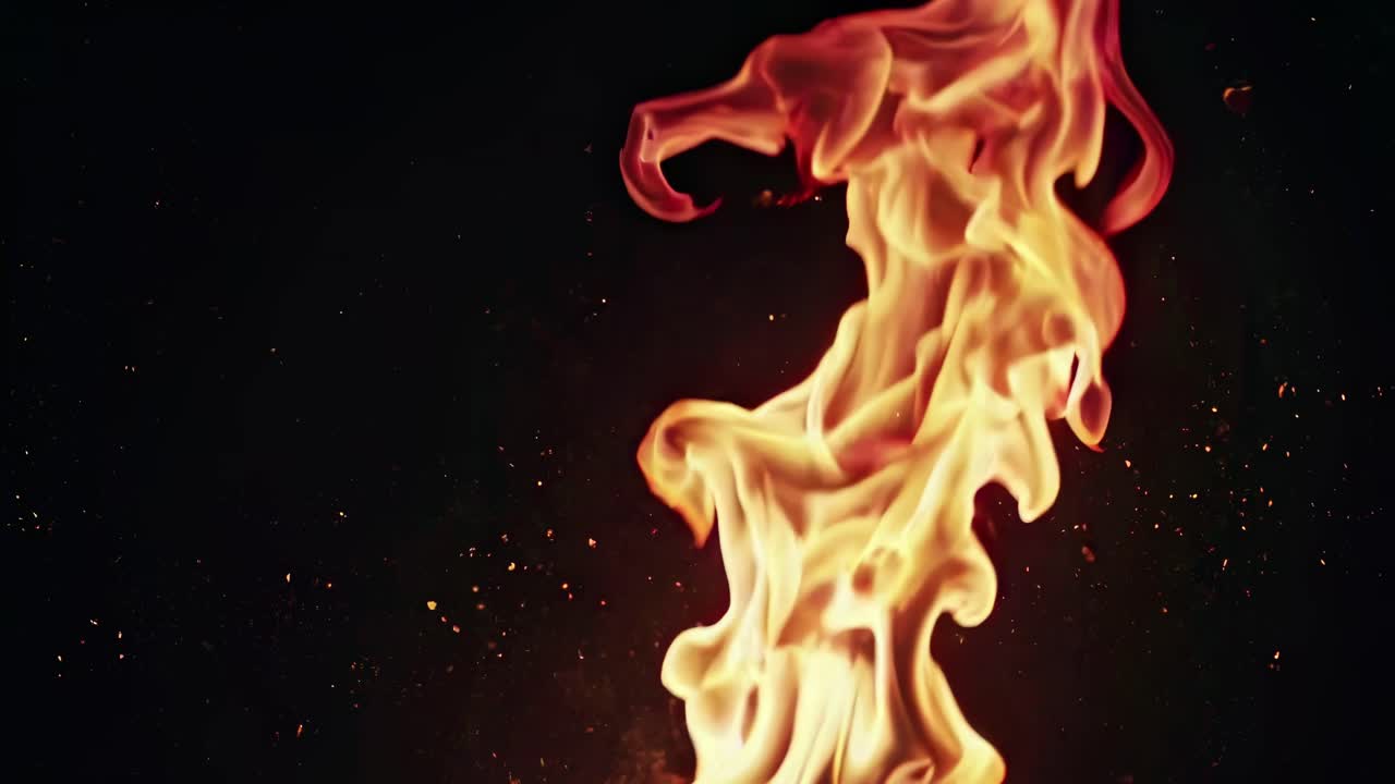 Close-up video of swirling flames against a dark background, captured from a low angle