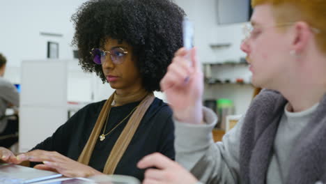 young black businesswoman having talk with coworker in the office