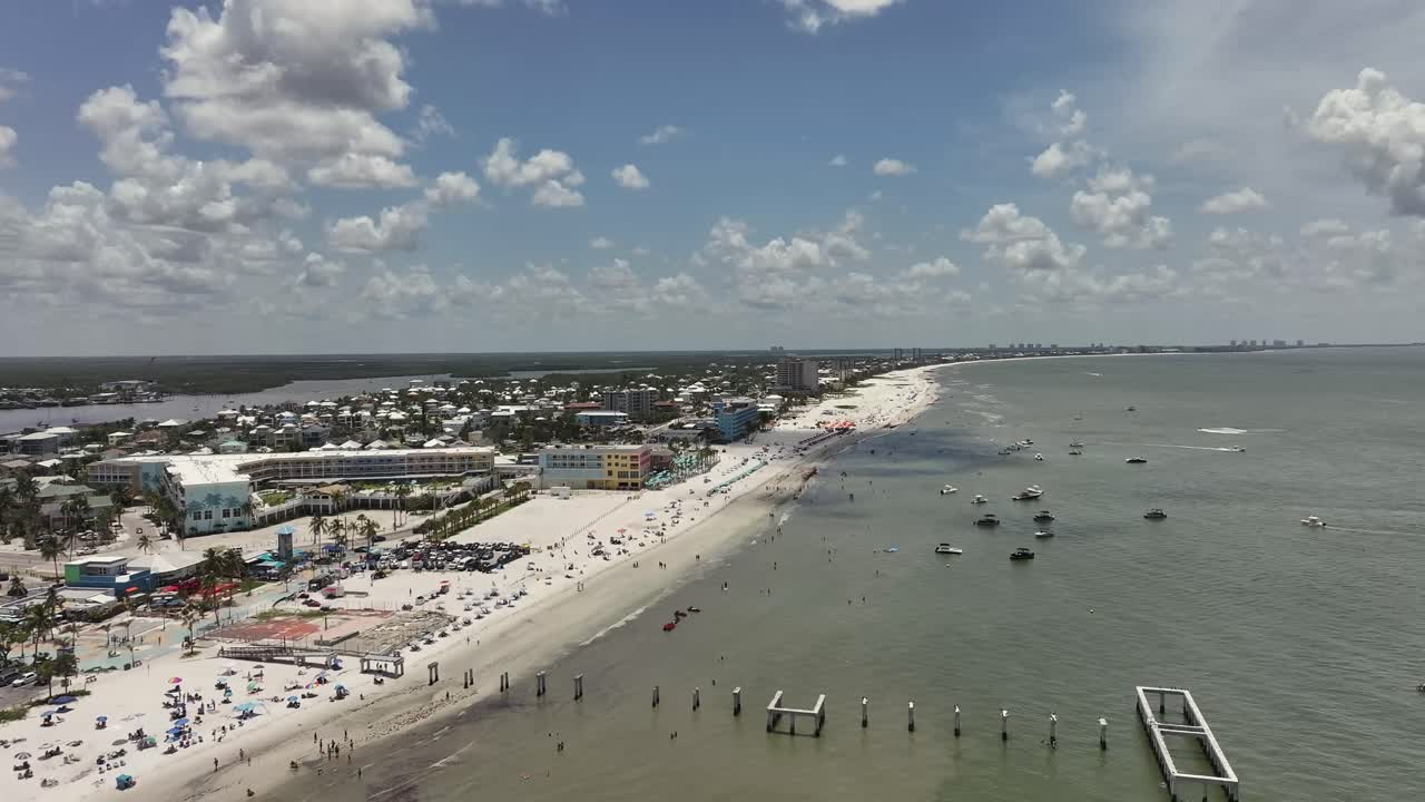 Busy Ft Myers beach on a sunny day aerial view