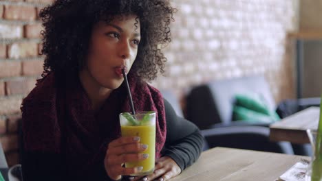 woman drinking fresh smoothie