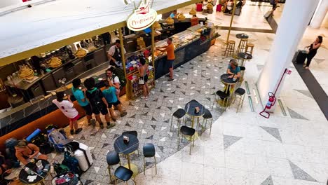 people interacting in a bustling cafe environment