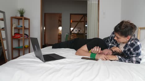 couple relaxing on bed