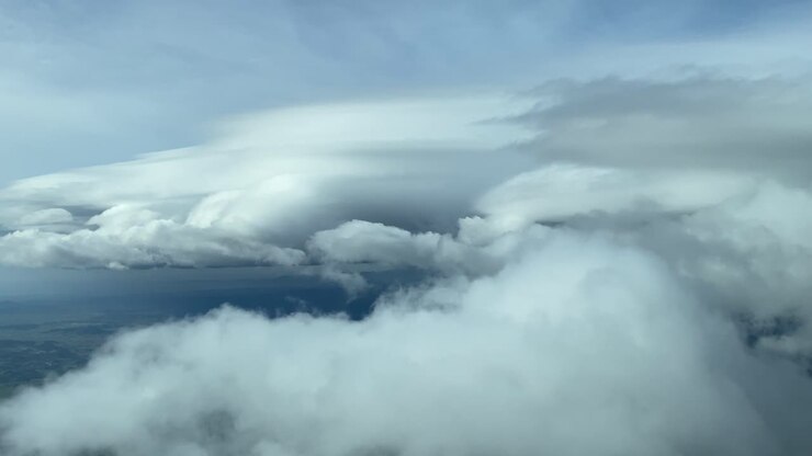 Flying through some clouds over Palma de Mallorca, Spain, taken from a cockpit