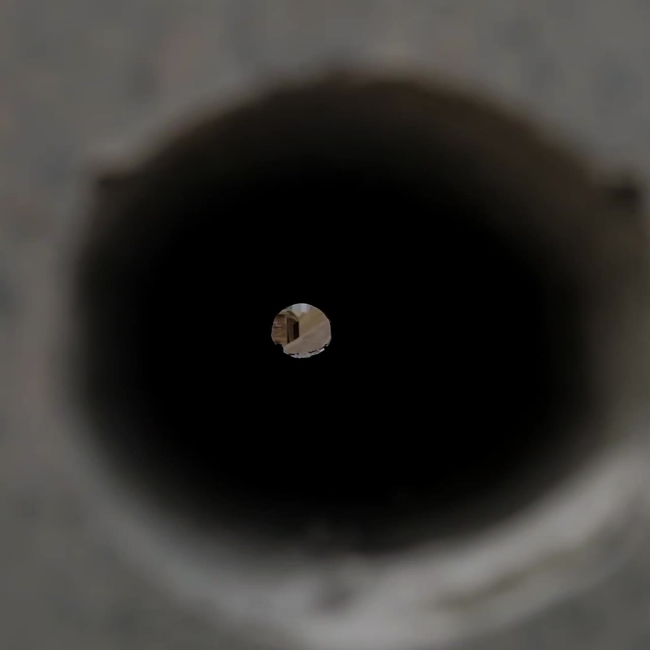 Looking at the hole of the cement block. Concrete construction material close up