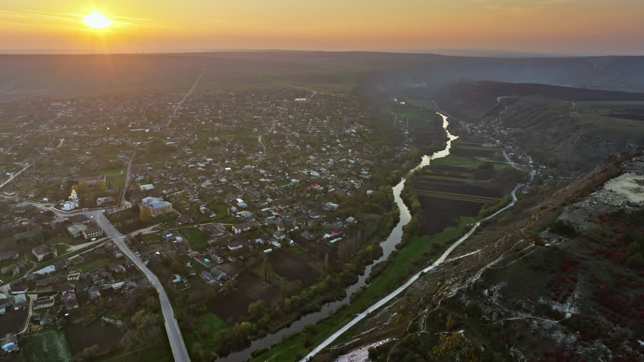 Aerial drone view of Orhei, Moldova and the Raut river at sunset