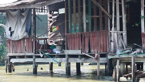 wooden house by canal, bangkok floating market