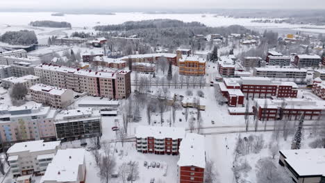 aerial view of a snowy town in finland