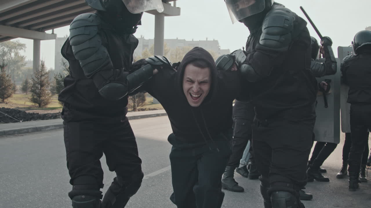 Riot Police Arresting Protester