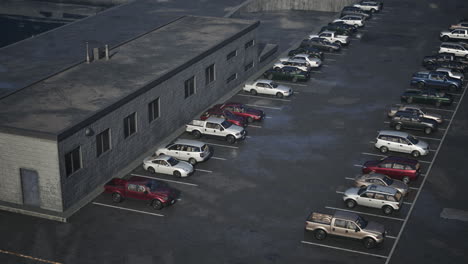 a parking lot full of cars and trucks