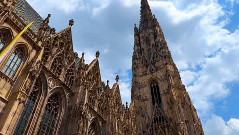 vienna, austria - june 9, 2025: historical architecture of old town in vienna, austria. low angle view at the exterior of saint stephen's cathedral