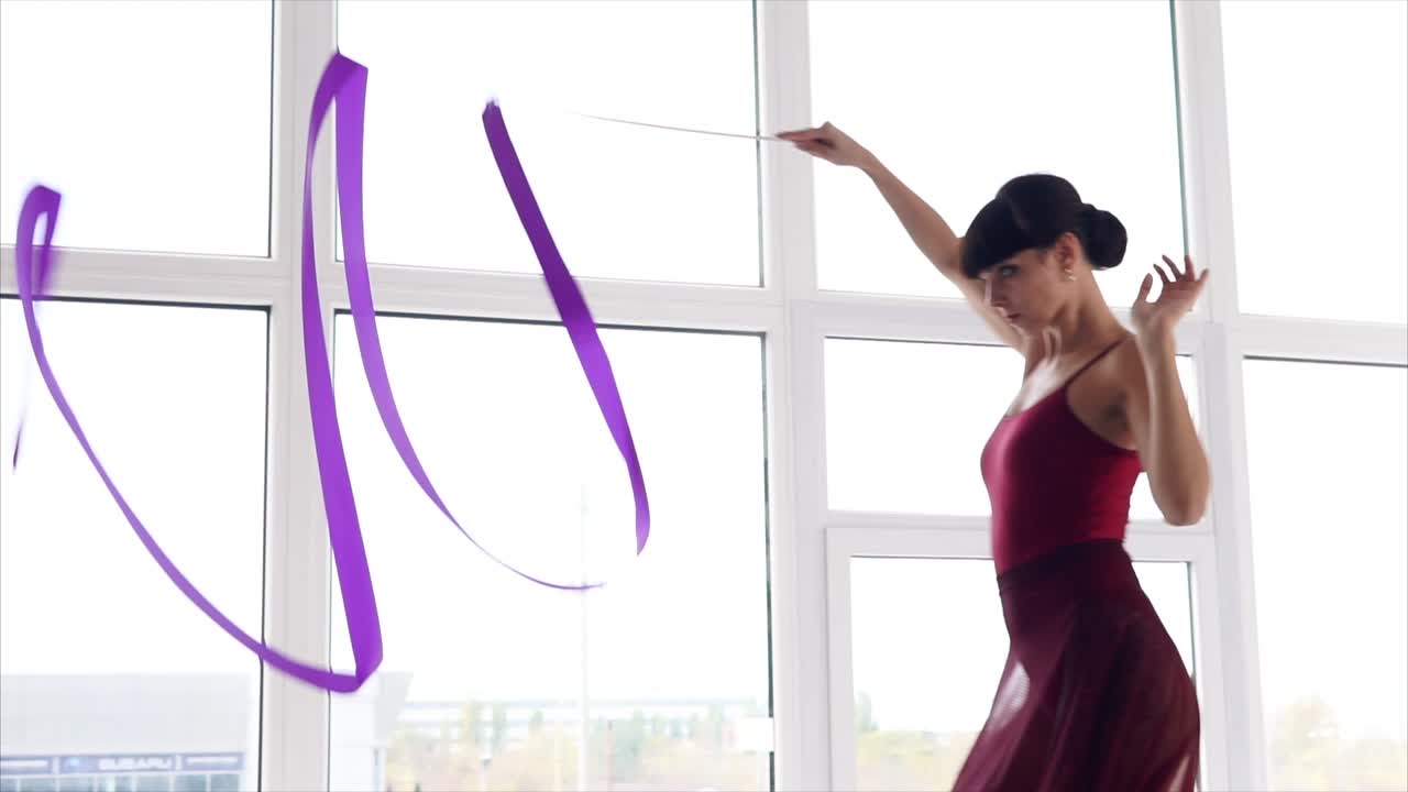 Woman Performing Ribbon Dance in a Studio