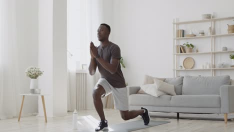 man doing yoga/stretching at home