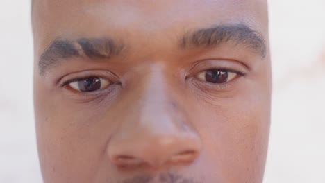 portrait of happy african american gay man looking at camera and smiling, slow motion