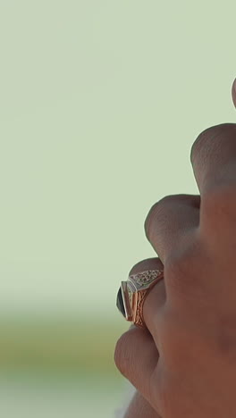 young wife wearing gorgeous wedding dress with white laces in summer park closeup slow motion. hand strokes arm. marriage ceremony and life event holiday