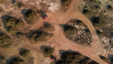 Two-Four-Wheelers-race-around-the-bending-trails-in-Cavo-Greko,-Cyprus