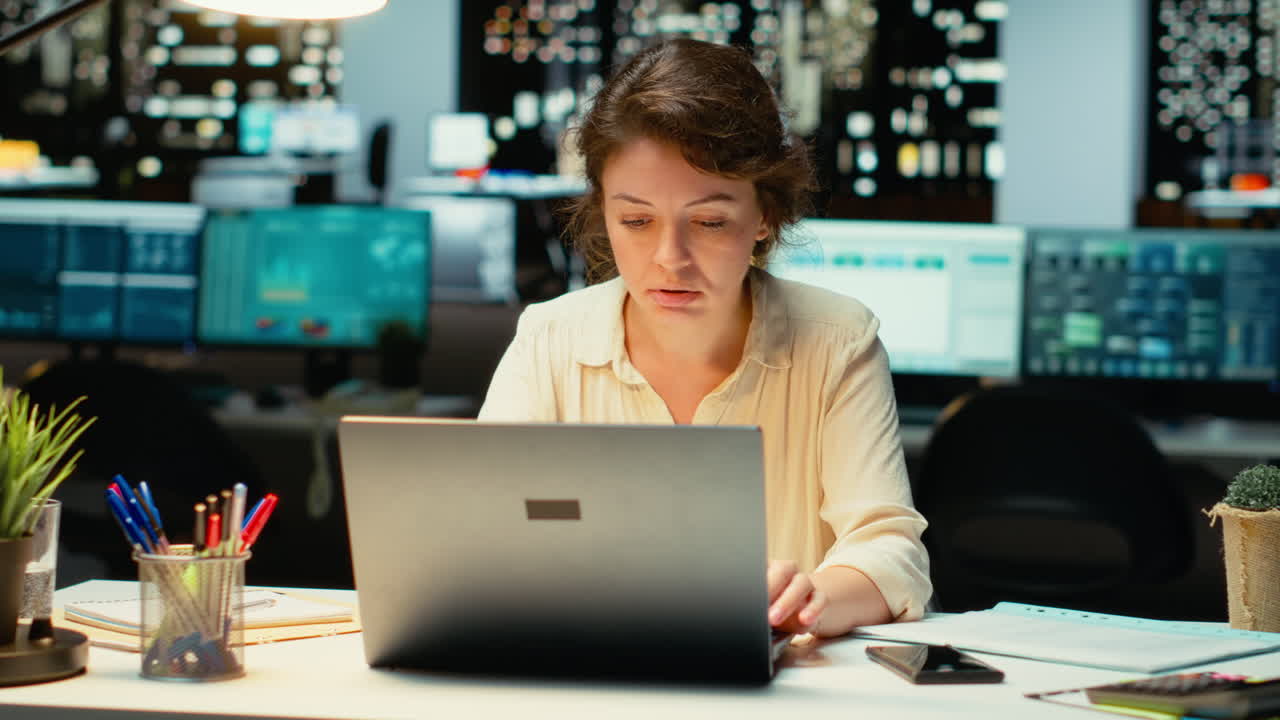 Vertical Video Woman finishes methodical planning after hours and closes the lamp