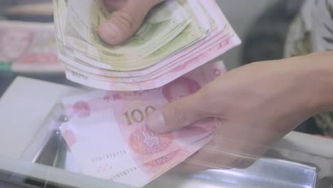 hands count the number chinese yuan bills. bank cash desk