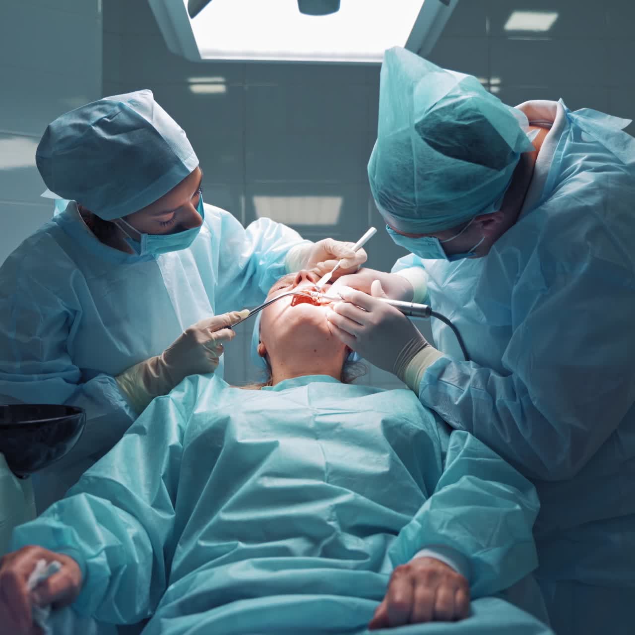 Dentist repairing patient tooth