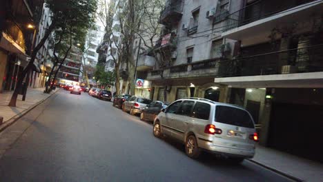 pov driving through small street of buenos aires city in recoleta neighborhood at sunset