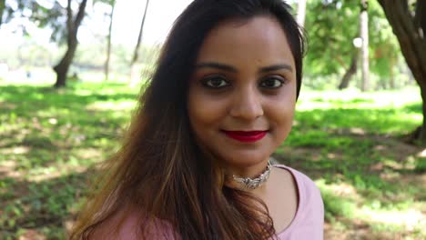 Beautiful-Indian-woman-smiling-and-looking-at-the-camera-in-slow-motion