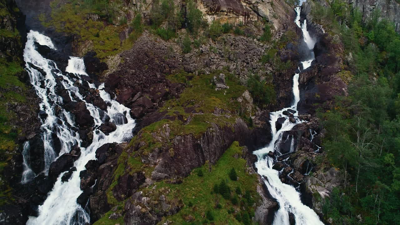 Aerial Forward Tilt Down over Twin Falls of Låtefossen at Dusk