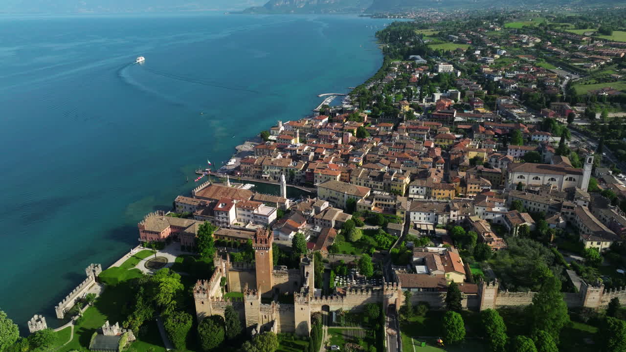 Lazise Town On The Eastern Shore Of Lake Garda In Veneto, Italy. - aerial shot