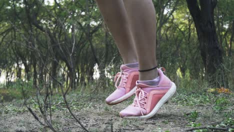 Athletic-Beautiful-Woman-Exercises-with-Jump,-Skipping-Rope-in-the-forest