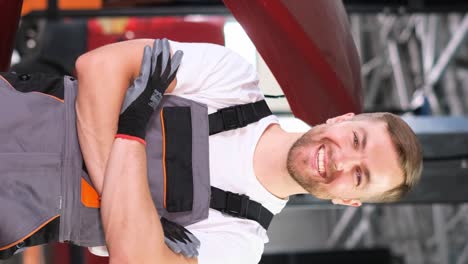 Professional male mechanic in a car repair shop