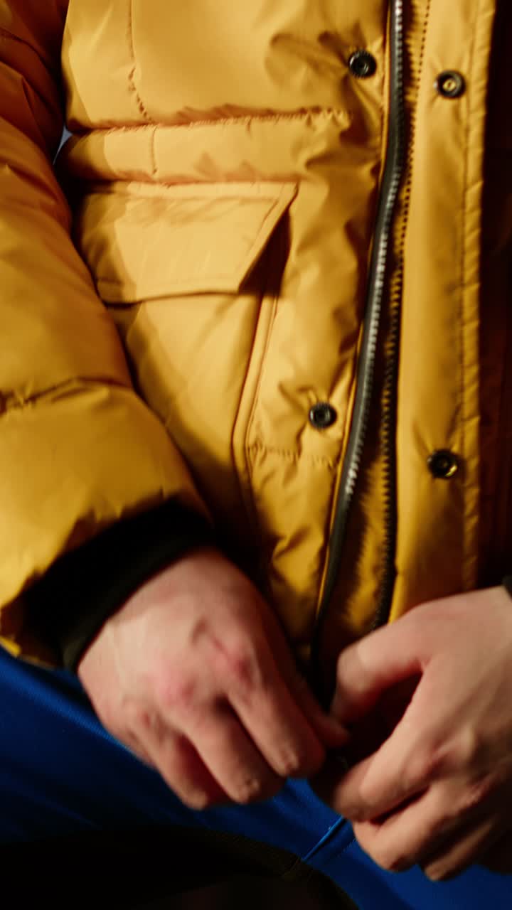 Bearded Man Zipping and Unzipping Yellow Puffer Jacket