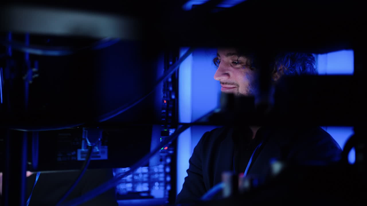 A man and a woman talking in a server room