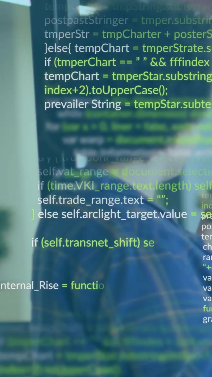 Software dev turning and leaning as code overlay moving across glass then settling into clear block