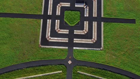 modern square target cemetery pathway design aerial rising birdseye view artistic garden of rest graveyard