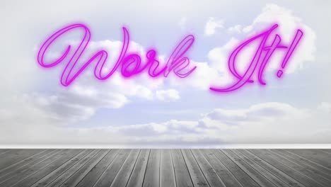 work it graphic in pink neon on cloudy sky