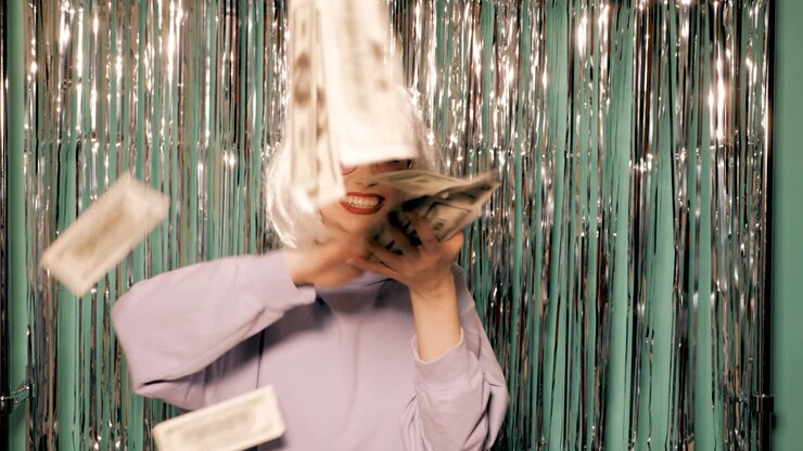 Woman Celebrating with Money