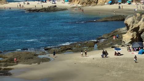 Aerial-telephoto-view-over-beach-in-Laguna-Beach,-California