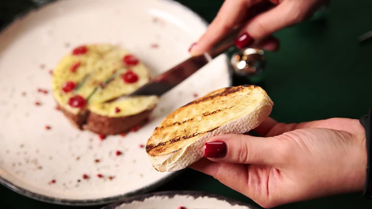 Woman eating pate with toast appetizer