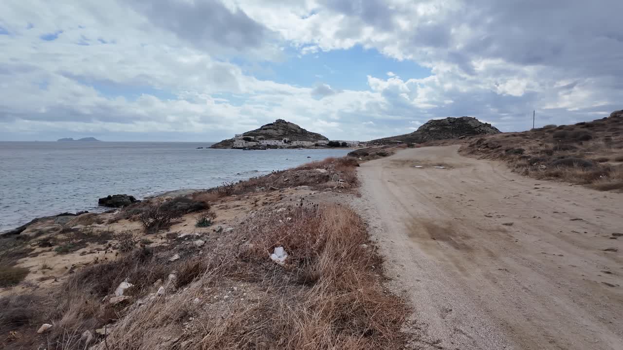 dry gravel dirt road, desert like, conditions on Kalafati Beach, Mykonos, Greece