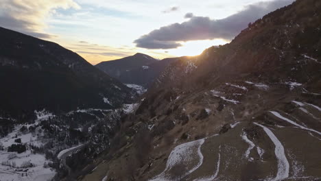 Smooth-orbit-drone-in-the-Tarter-valley-to-Andorra,-in-the-golden-hour,-with-the-sky-full-of-clouds