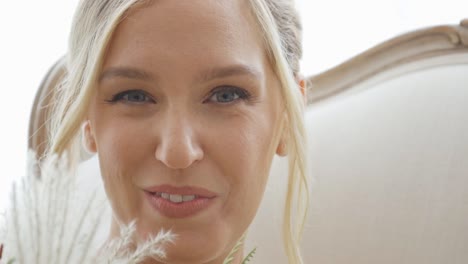 bride with beautiful eyes looks up and smiles